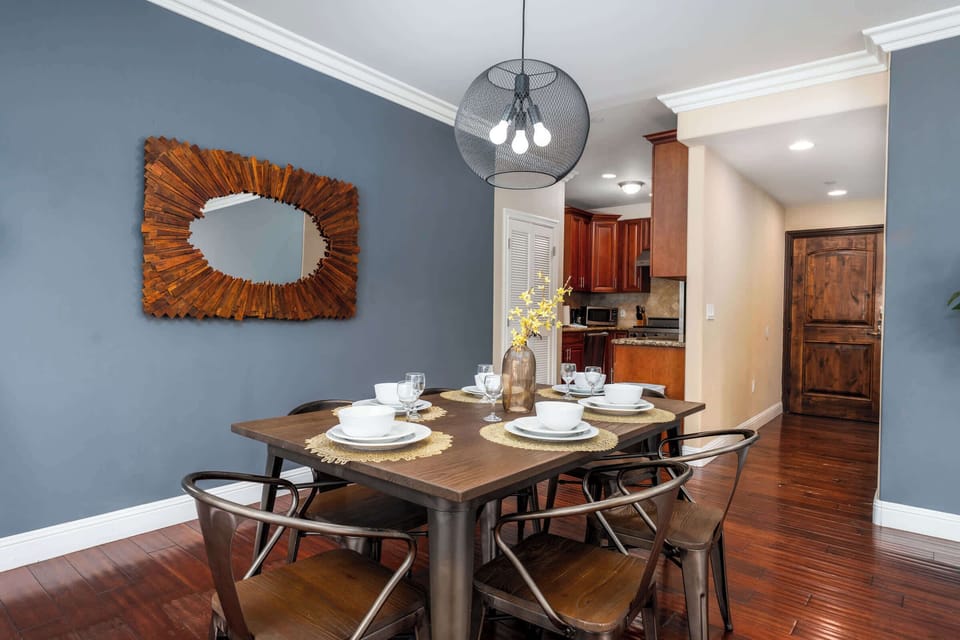 Dining area with contemporary lighting and decor