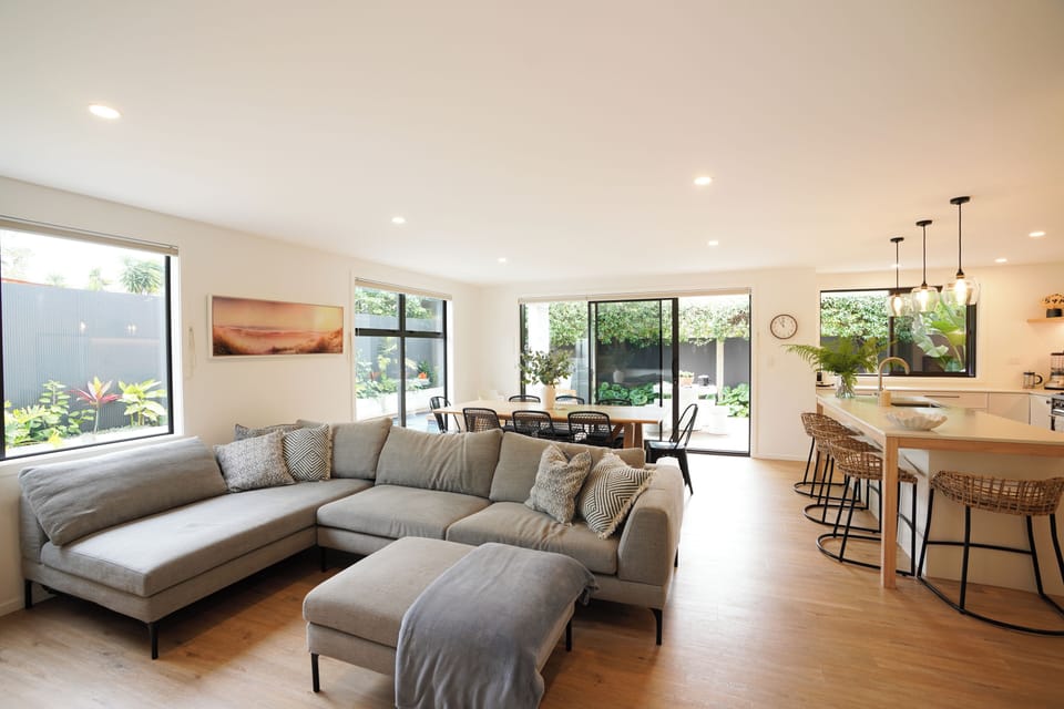 open kitchen into the dining area, the outdoor BBQ are and pool