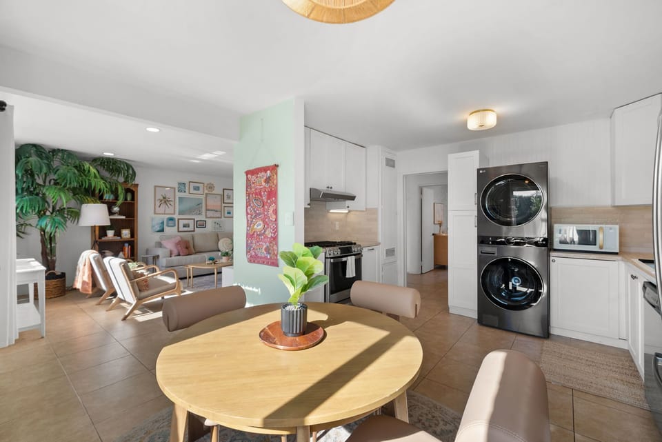 Open kitchen with modern appliances and a view into the comfy living area.