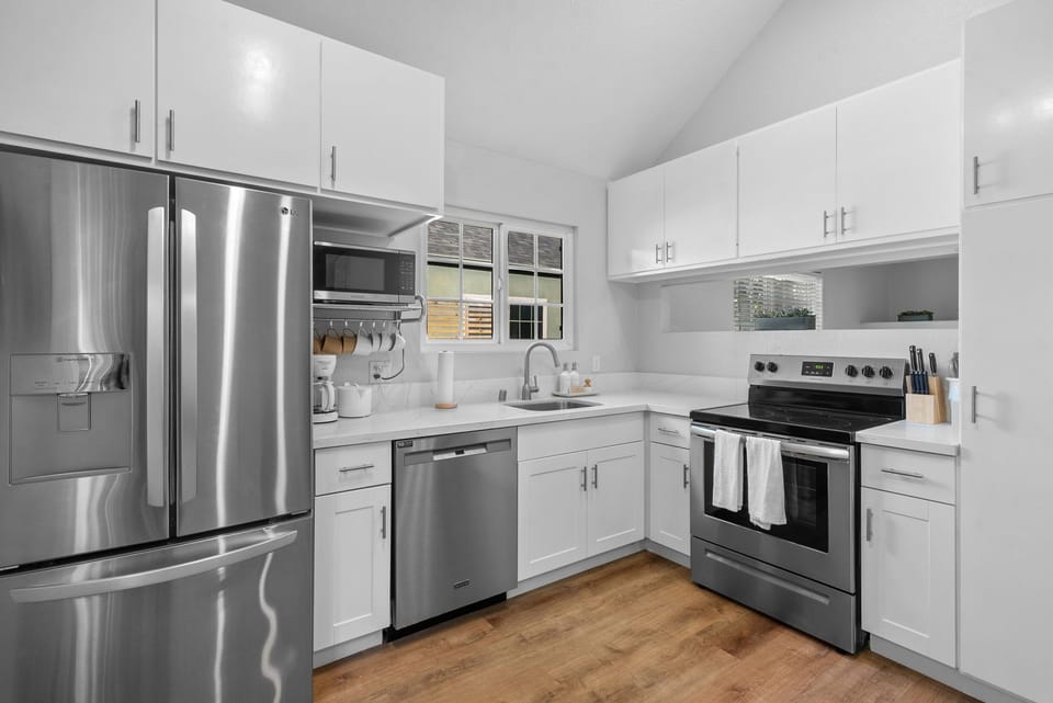 Full kitchen with modern appliances and all you need to whip a meal. 