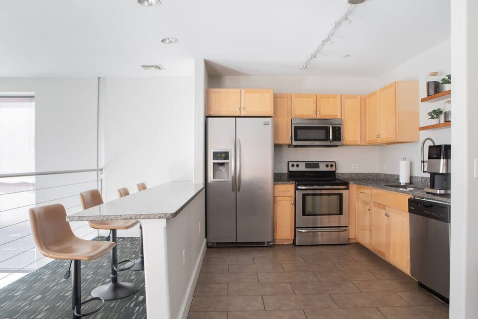 Shared building clubroom, game room, and kitchen