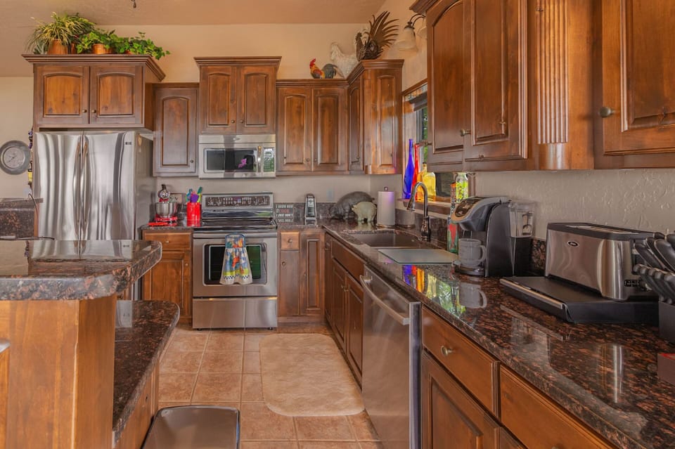Fully stocked kitchen with Keurig coffee maker.