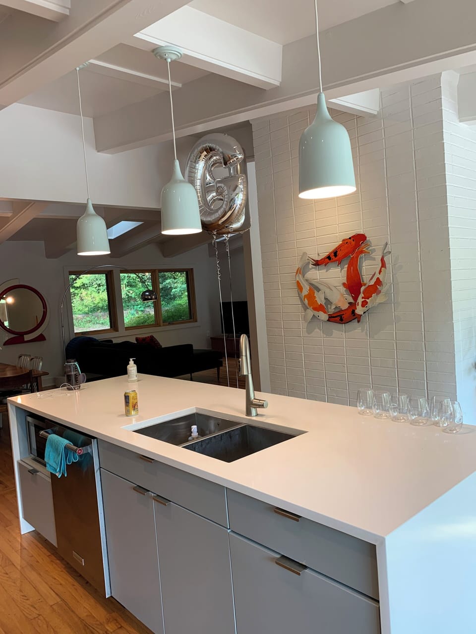 Open kitchen allows for everyone to gather .