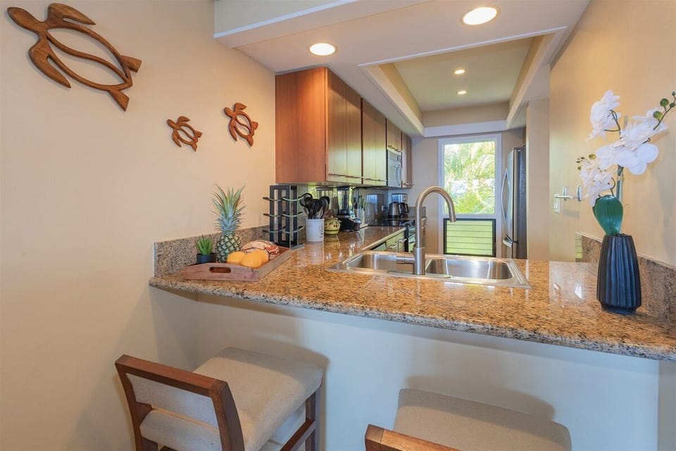 A breakfast bar with seating for two offers a relaxed space for morning coffee or a quick bite