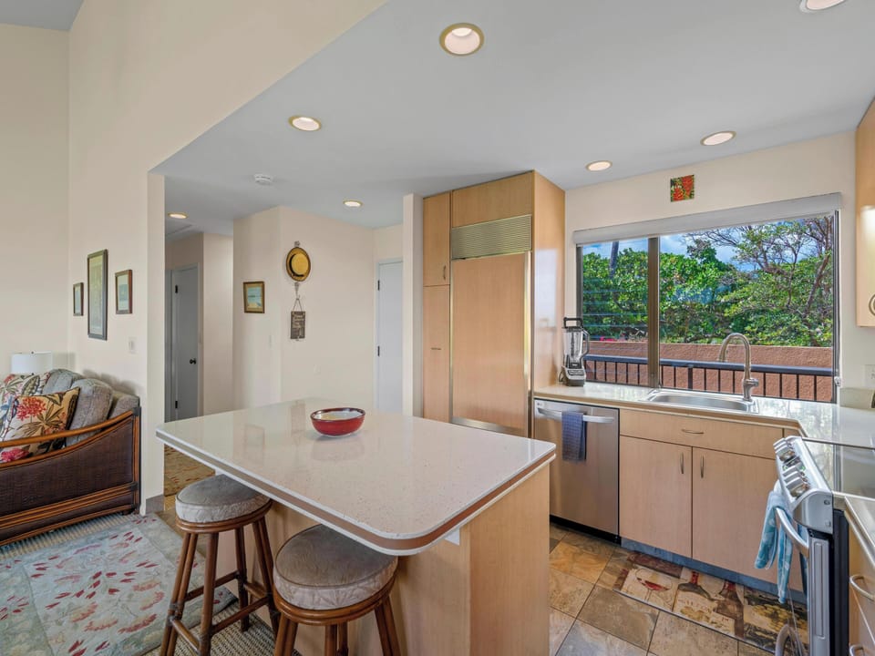 An exquisitely updated maple kitchen provides everything you need to easily prepare family meals.