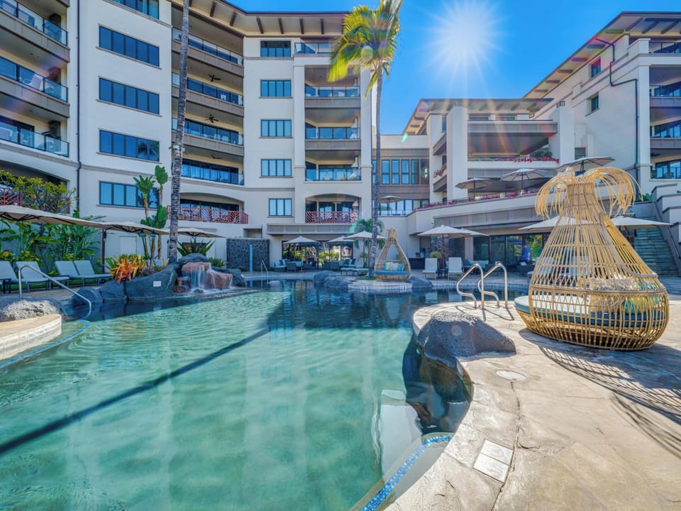 The family pool located near the top of the property offers plenty of fun and comfortable seating and lounging options.
