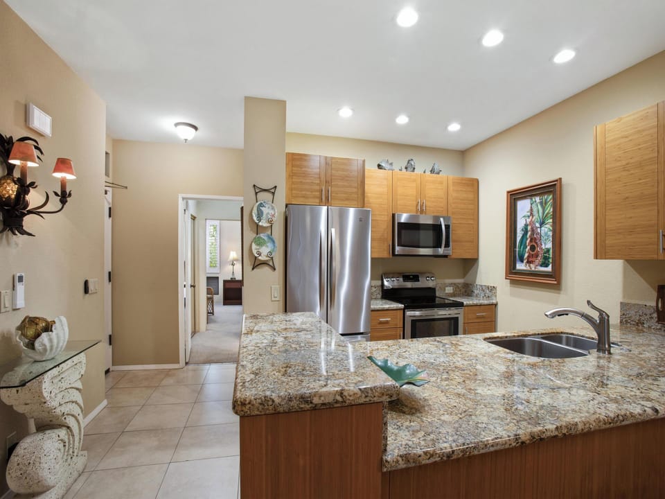 Picture yourself preparing meals on these gorgeous granite countertops, with modern stainless appliances and plenty of space to gather. The open layout invites you to cook, share stories, and create vacation memories together.