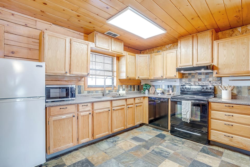 Fully equipped kitchen with ample counter space for meal prep and entertaining.
