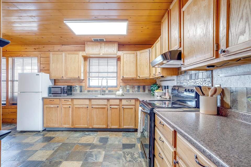 Spacious kitchen featuring modern appliances and all the essentials.