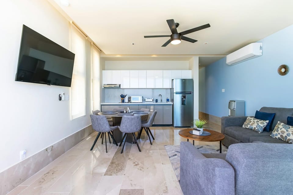 Bright and airy living room with modern dining area and kitchen view