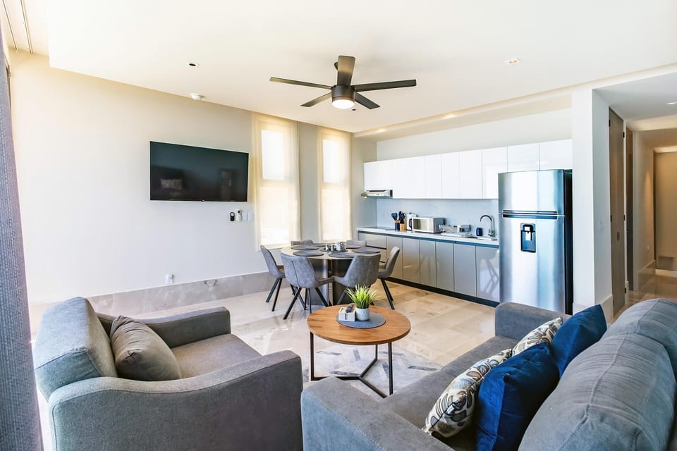 Bright, open living area with modern kitchen and cozy seating