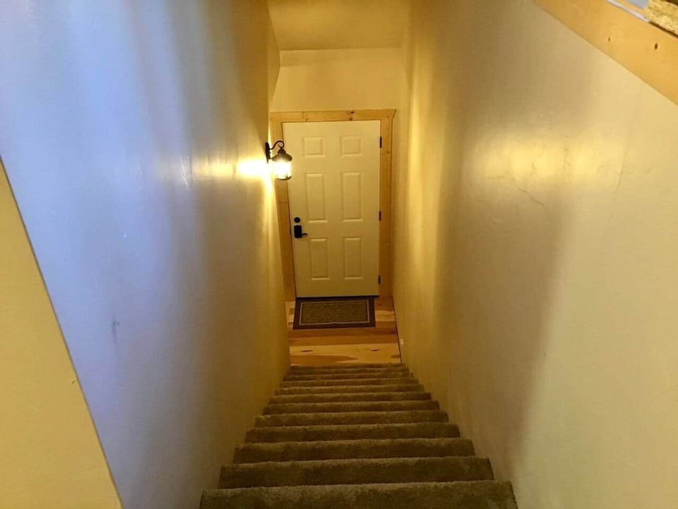 Stairs up tp loft above the garage.