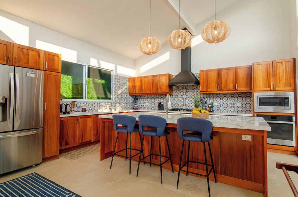 The chef's kitchen is fully equipped with large and small appliances