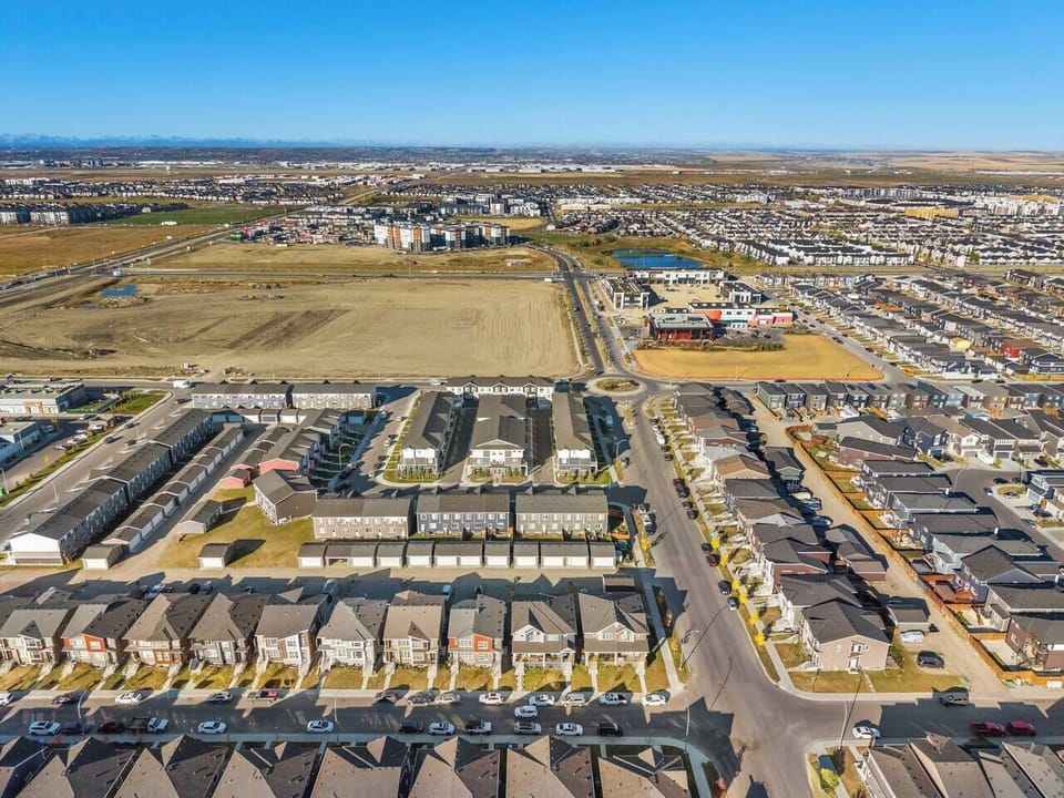 Aerial view of the residential community with surrounding neighborhoods and open spaces