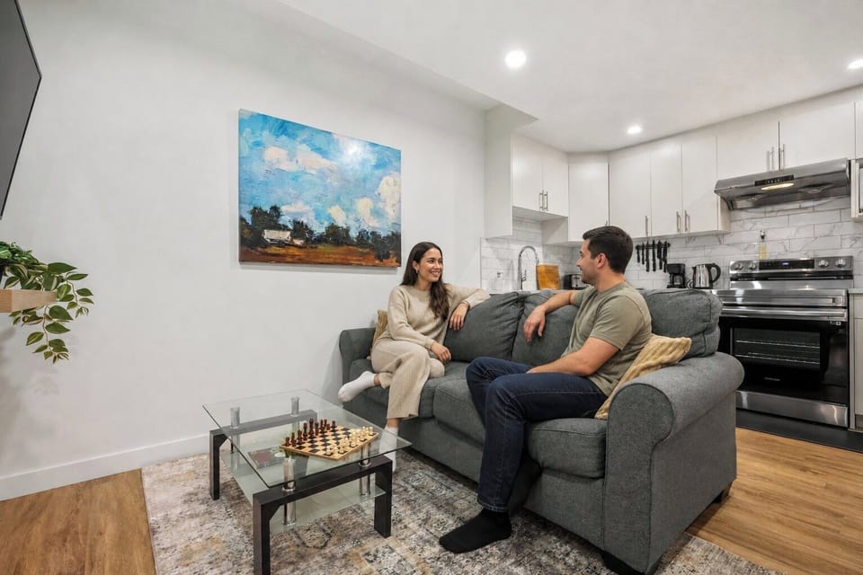 Comfortable living room with direct access to fully equipped kitchen.