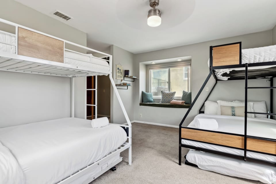Bunk room with clean design and natural light. 
