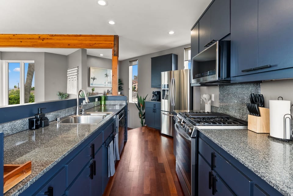 Sleek modern kitchen with high-end appliances. 