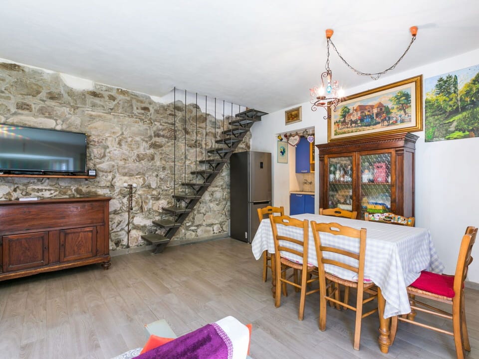 Flooring, Furniture, Door, Chair, Houseplant, Wood Stain, Stone Wall, Kitchen & Dining Room Table, Hardwood, Flowerpot