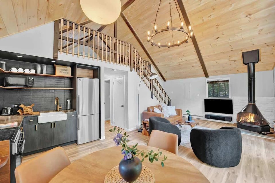 Open Concept Living Area with Loft and Wood Ceilings