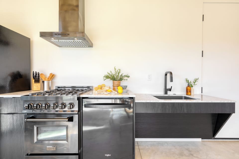 Kitchen features a gas range.