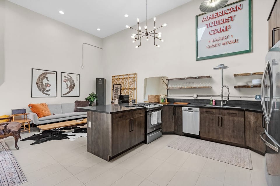 Kitchen includes a dishwasher, gas cooktop, full-size refrigerator.