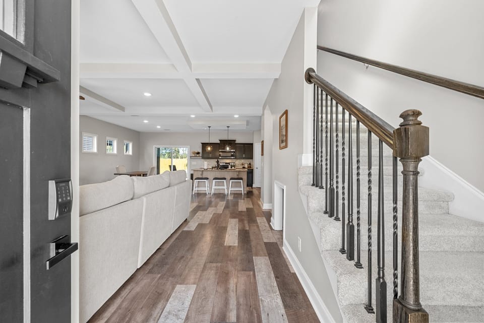 Spacious open-concept living and dining area with modern finishes