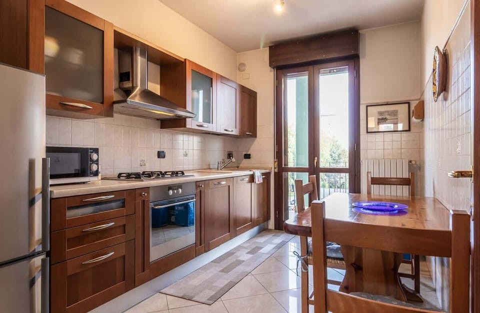 bright living kitchen fully equipped with balcony