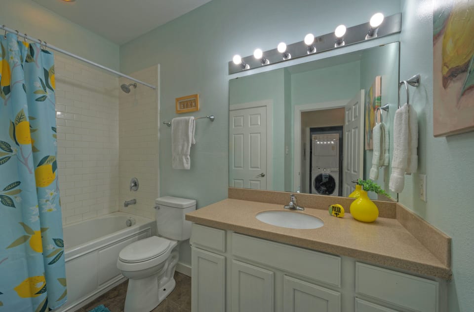 Full bathroom features a shower/tub combo.