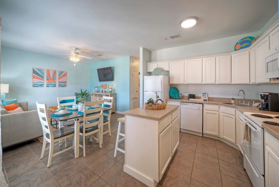Transition seamlessly to the kitchen area.