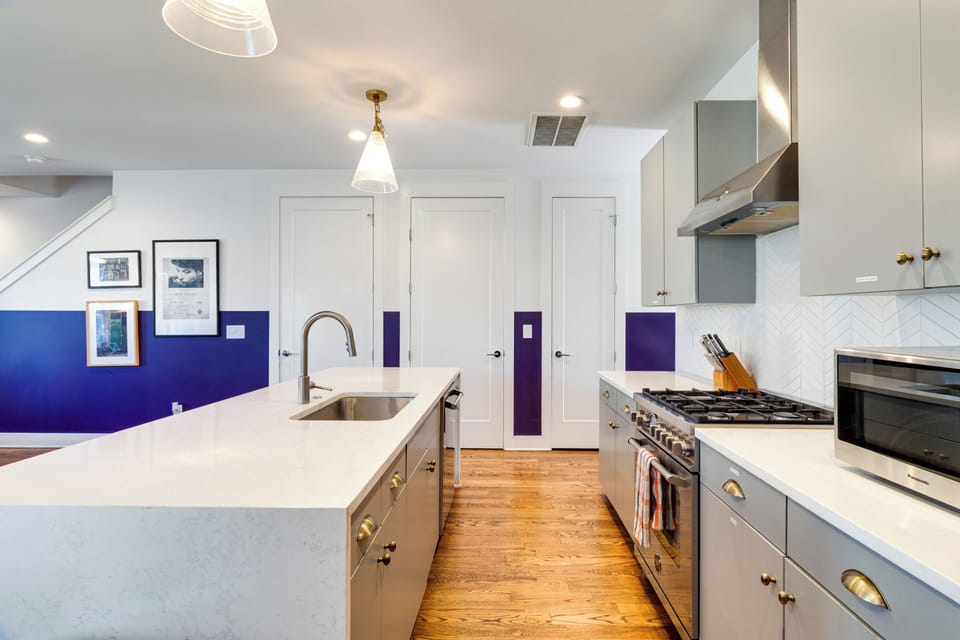 Kitchen features an island and modern appliances.
