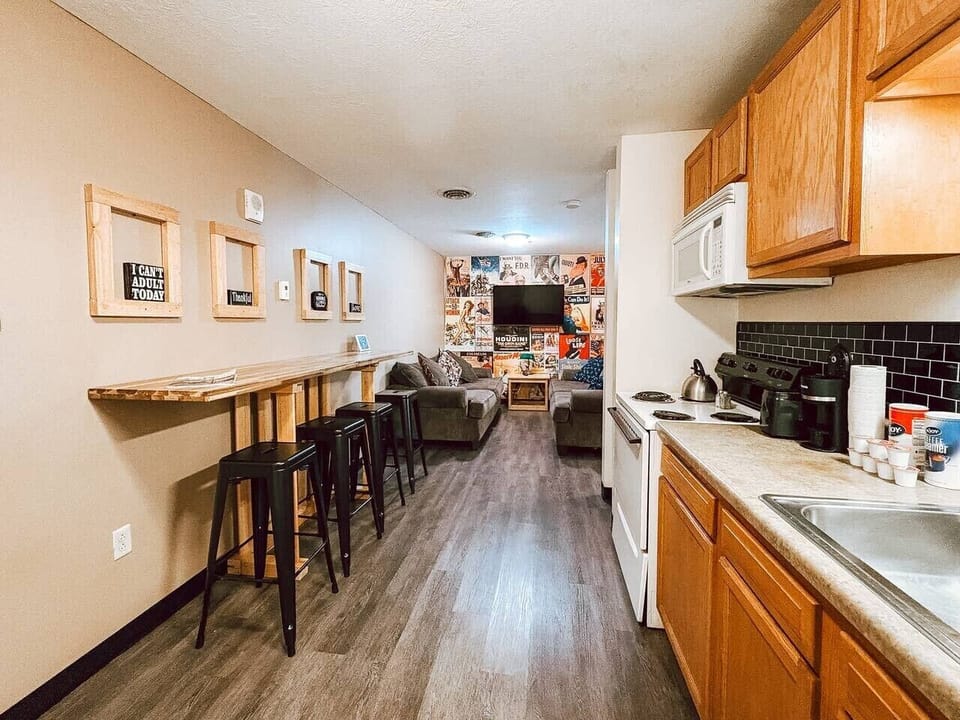 Long bar-top seating flows into an open kitchen, perfect for group hangouts.