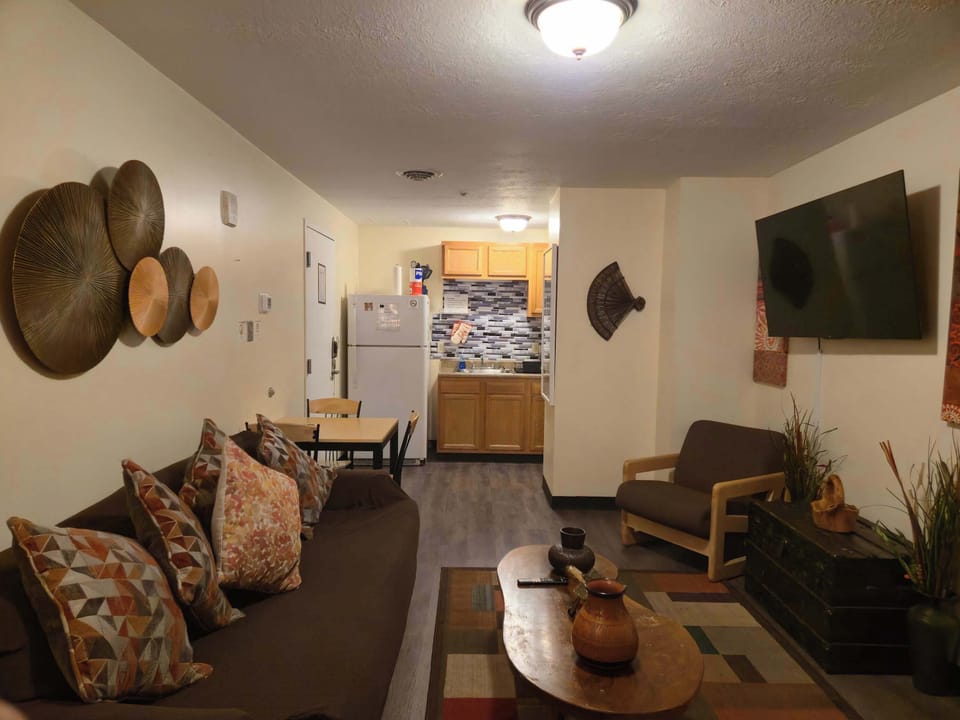 Vibrant open living space with eclectic décor and cozy layout