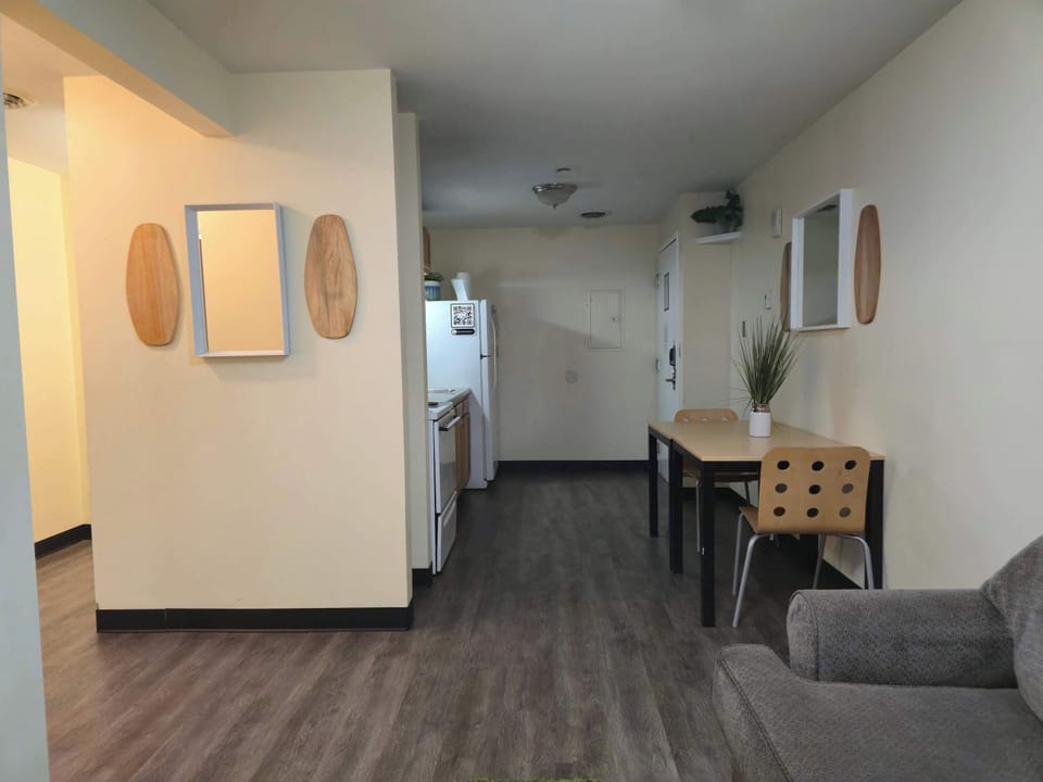 Spacious layout with dining area and open kitchen view, modern flooring throughout