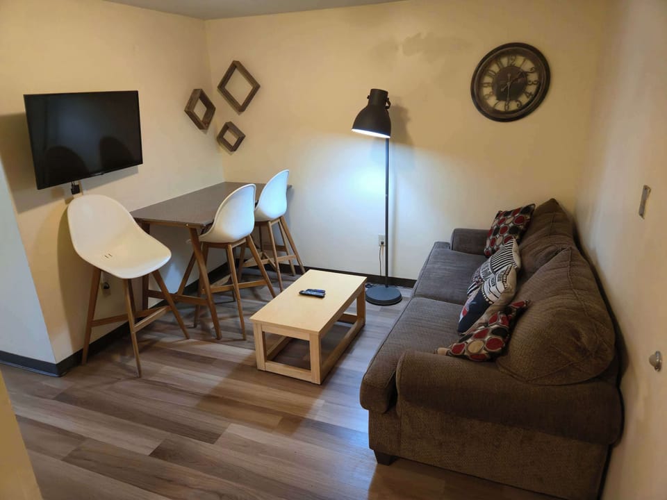 Stylish lounge with plush seating and smart use of space for dining and relaxing