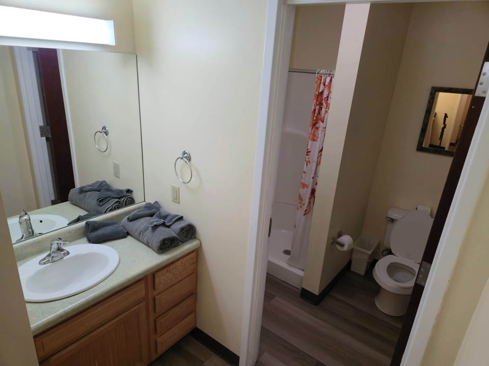 Compact bathroom with bright lighting and practical layout
