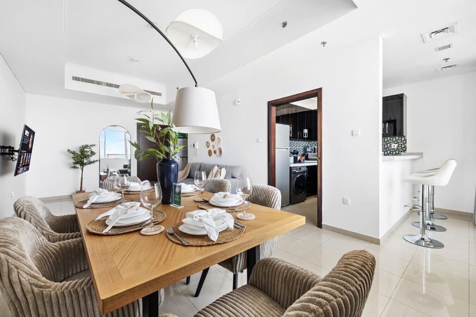 Elegant dining setup with plates, cups, spoons, and a protective cloth for a tidy meal