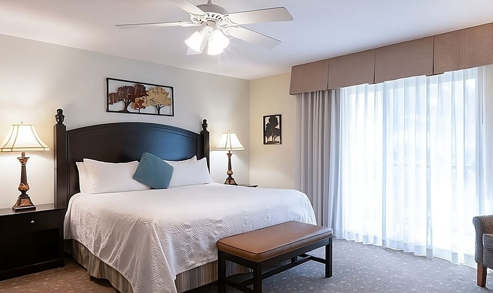 Unwind in a bright, airy bedroom with crisp linens.