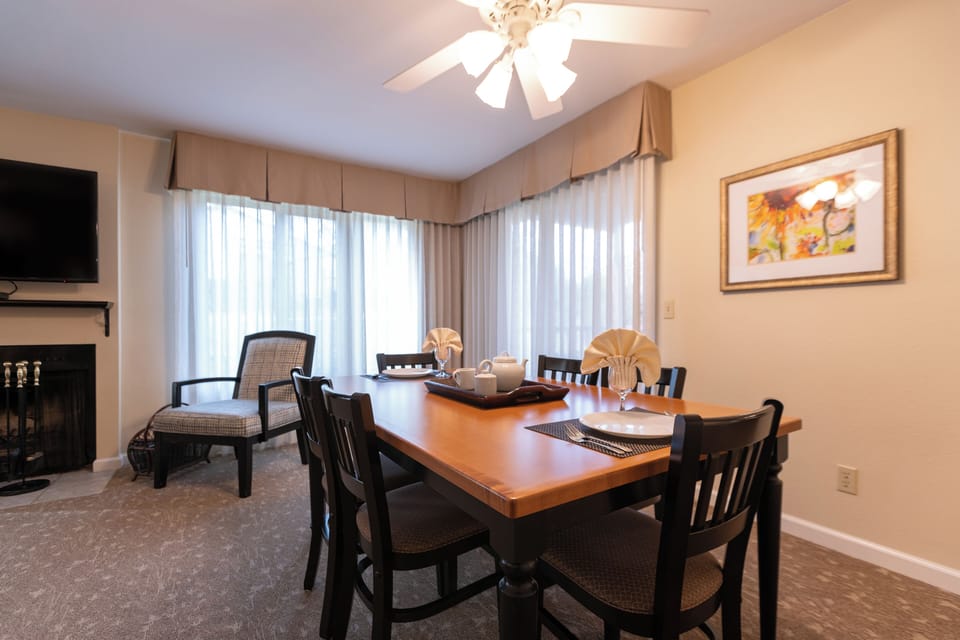 Host cozy meals by the fireplace in this inviting dining space.