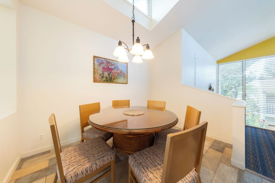 Share meals and stories around a cozy round dining table.