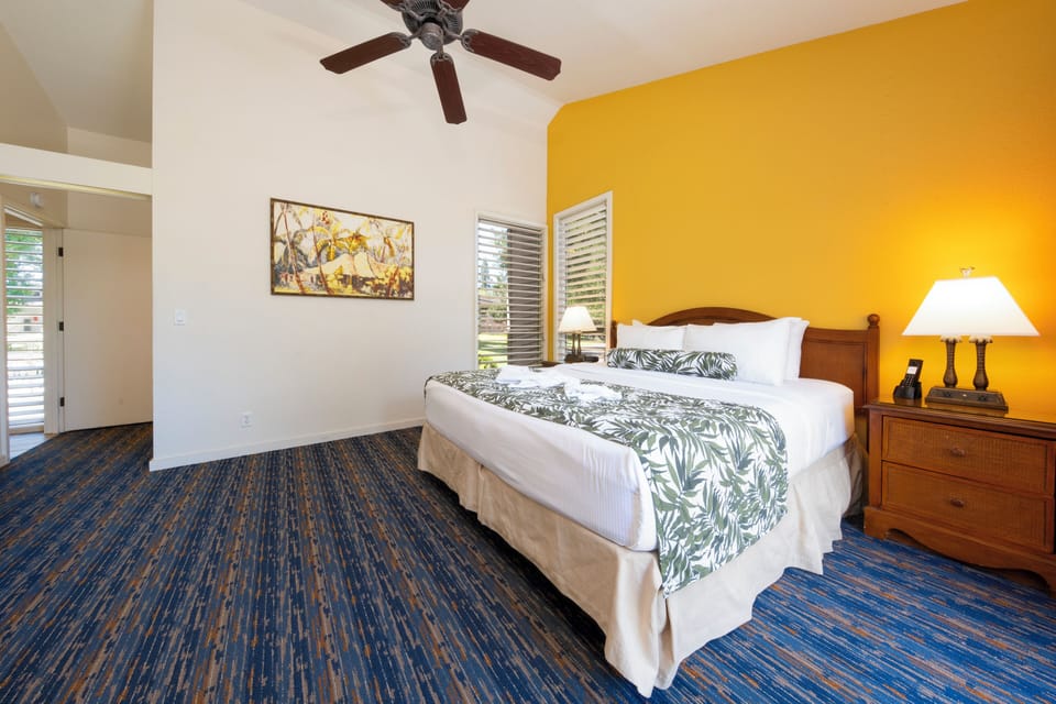 Sink into crisp linens in this sunny, island-inspired bedroom.