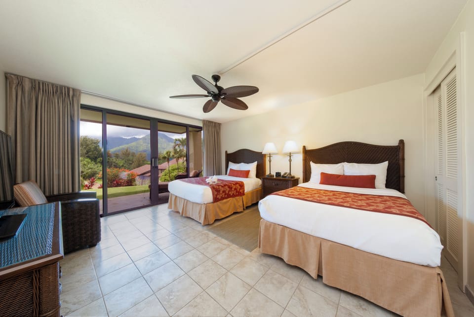 Unwind in crisp beds with garden-facing sliding doors.