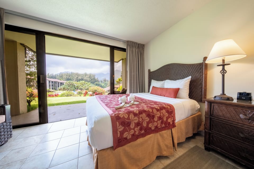 Wake up to garden views from your serene king bed.
