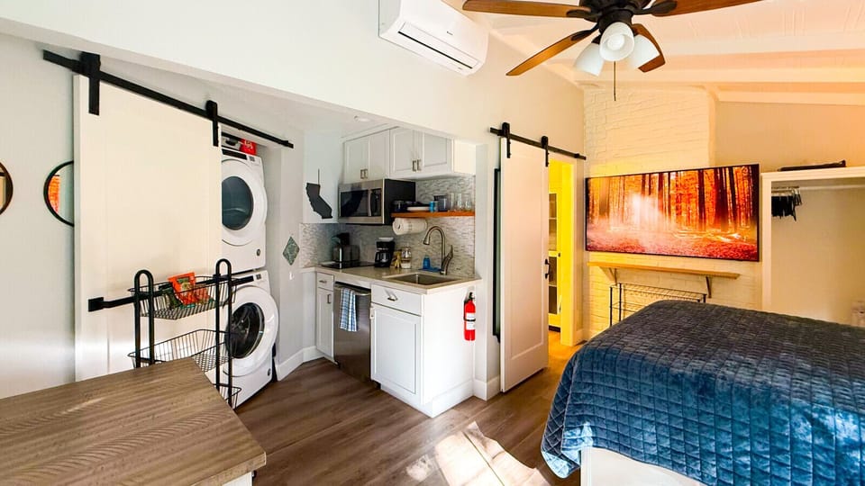 The bathroom is separated from the studio by another sliding barn door