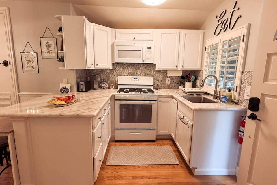 The kitchen has a stove, oven, microwave, toaster, and coffee maker. It`s also stocked with basic cooking necessities such as dishes, silverware, oil, vinegar, salt, pepper etc.