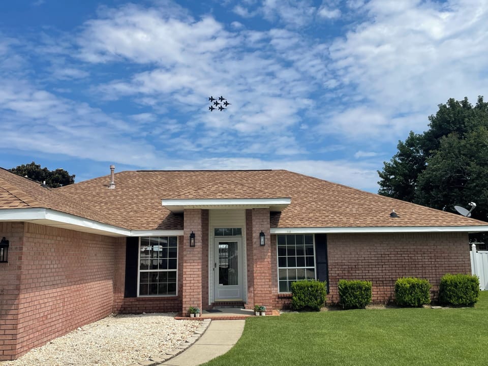Blue Angels flying over house during a practice.