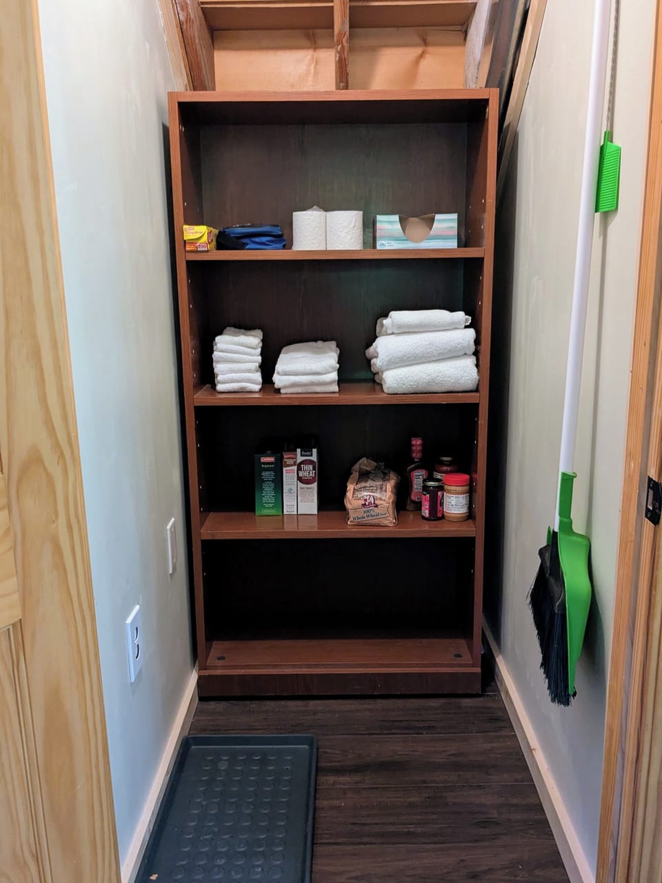 Pantry and overflow storage closet for kitchen across from main entrance
