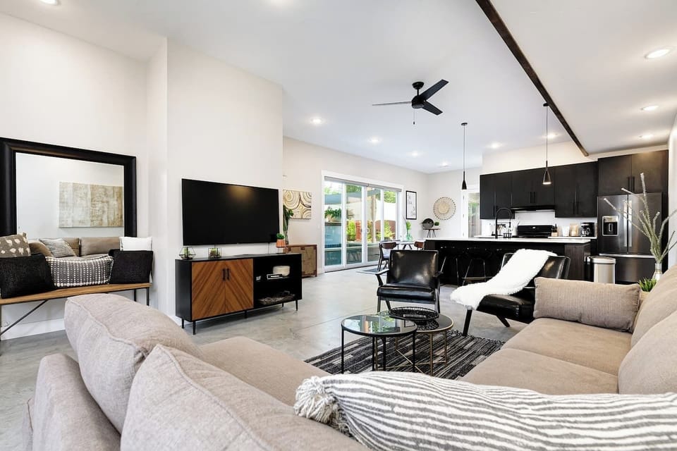 The main floor  boasts an open concept living area including a large sectional and oversized smart TV so you can enjoy the big game or movie night with your friends.  