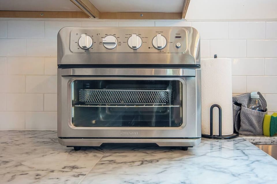 Top of the line appliances and easy to clean surfaces adorn the kitchen