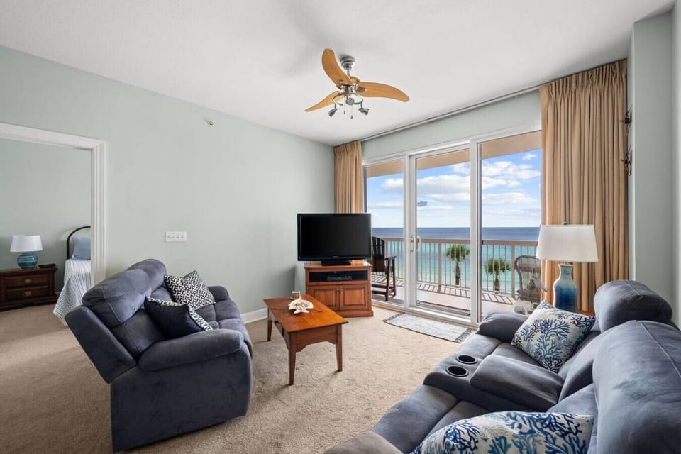 Living Room with Plush Couches, Flat Screen TV, Private Balcony Access and Stunning Ocean Views