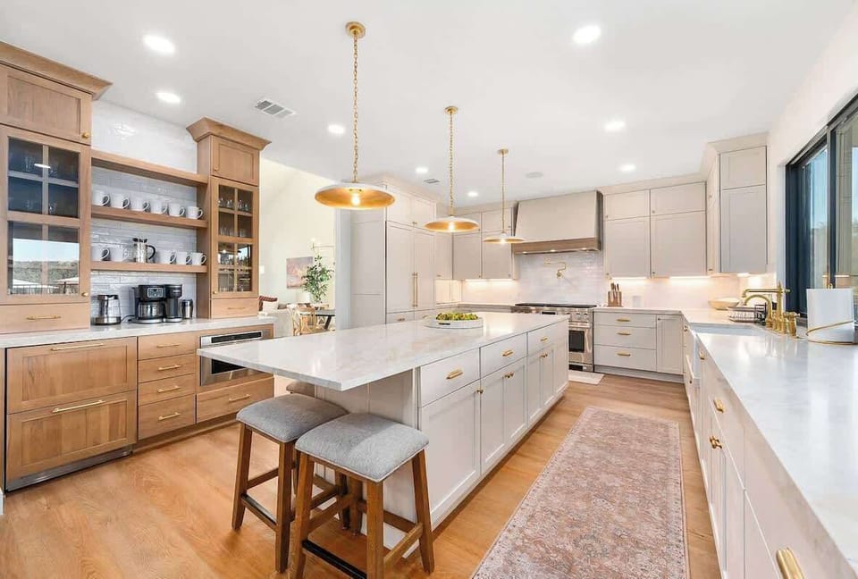 The gourmet kitchen is made for entertaining with plenty of seating, counter space, and views of the pool deck outside!